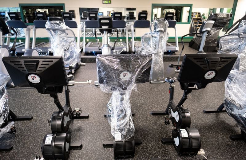 Cardio machines are wrapped in plastic to prevent use in the fitness facility at Georgia Gwinnett College in Lawrenceville, where admission will be by appointment only. BEN GRAY FOR THE ATLANTA JOURNAL-CONSTITUTION