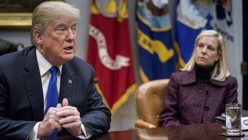 President Trump, with Secretary of Homeland Security Kirstjen Nielsen, right, speaks during a meeting with Republican Senators on immigration at the White House last week. (AP Photo/Andrew Harnik, File)