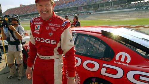 Bill Elliott is all grins after his qualifying run Sept. 26, 2003, at the Talladega Superspeedway in Talladega, Ala.
