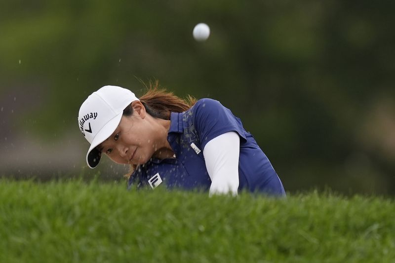 Yan Liu, of China, hits out of a bunker on the 17th hole during the final round of the LPGA Kroger Queen City Championship golf tournament at TPC River's Bend in Maineville, Ohio, Sunday, Sept. 22, 2024. (AP Photo/Carolyn Kaster)