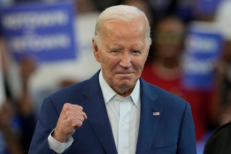 President Joe Biden is gesturing before speaking at a campaign event at Renaissance High School, Friday, July 12, 2024, in Detroit. (AP Photo/Carlos Osorio)