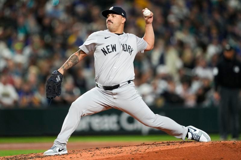 New York Yankees starting pitcher Nestor Cortes throws against the Seattle Mariners during the third inning of a baseball game Wednesday, Sept. 18, 2024, in Seattle. (AP Photo/Lindsey Wasson)