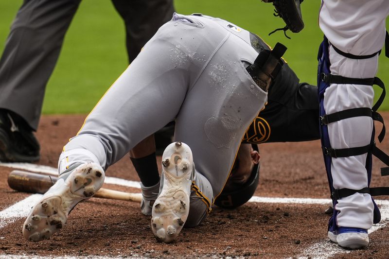 Pittsburgh Pirates second baseman Nick Gonzales (39) kneels injured against the Atlanta Braves in the first inning of a baseball game, Saturday, June 29, 2024, in Atlanta. (AP Photo/Mike Stewart)