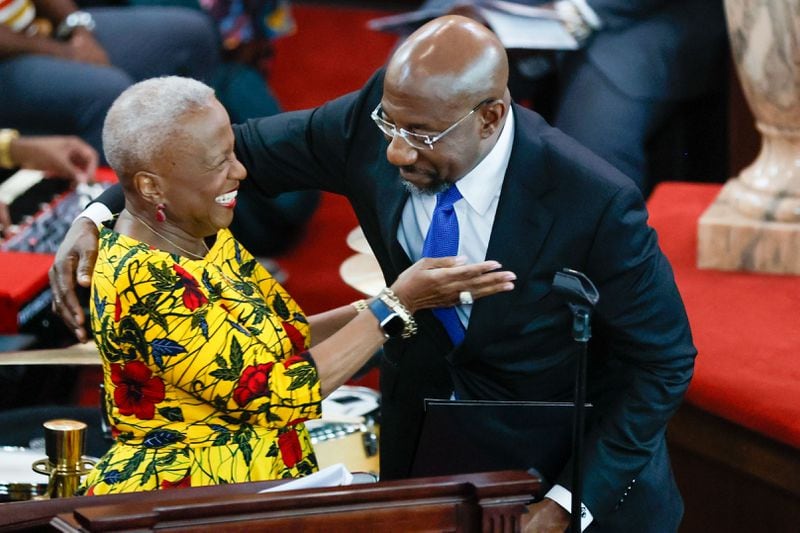 Mistress of ceremonies Monica Pearson greets U.S. Sen. Raphael Warnock during the commemoration of the life and legacy of MLK’s mother, Alberta King, on the 50th anniversary of Mrs. King's murder at Ebenezer Baptist Church on Sunday, June 30, 2024, in Atlanta.
(Miguel Martinez / AJC)