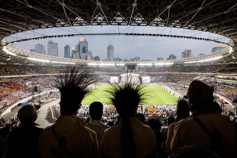 Catholic faithful attend a holy mass led by Pope Francis at the Gelora Bung Karno Stadium, in Jakarta, Thursday, Sept. 5, 2024. (Yasuyoshi Chiba/Pool Photo via AP)