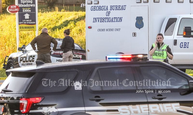 Holly Springs police, Cherokee County sheriff's deputies and GBI agents were at the scene Thursday morning.