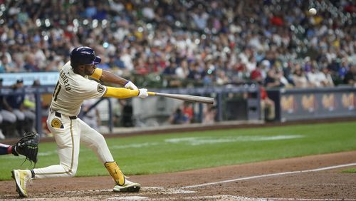 Milwaukee Brewers' Jackson Chourio hits a two-run home run during the eighth inning of a baseball game against the Atlanta Braves, Monday, July 29, 2024, in Milwaukee. (AP Photo/Aaron Gash)