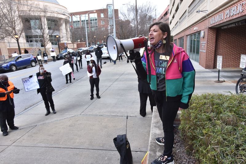 Tracey Pendley, APS teacher and 2020 Georgia Teacher of the Year awardee, speaks as APS teachers and supporters gather outside the Atlanta Public Schools headquarters to push for APS to delay reopening school buildings in this January 2021 file photo. For her, critical race theory means teaching history from multiple points of view. (Photo: Hyosub Shin / Hyosub.Shin@ajc.com)