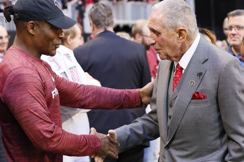 Falcons owner Arthur Blank shakes hands with former Falcons player Jessie Tuggle (58) moments before the Atlanta Falcons and Houston Texans game on Sunday, October 8, 2023, at Mercedes-Benz Stadium in Atlanta. 

Miguel Martinz/miguel.martinezjimenez@ajc.com