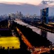 FILE - The European Central Bank stands at right as soccer players practise on a field next to the river Main, in Frankfurt, Germany, late Thursday, Sept. 19, 2024. (AP Photo/Michael Probst, File)