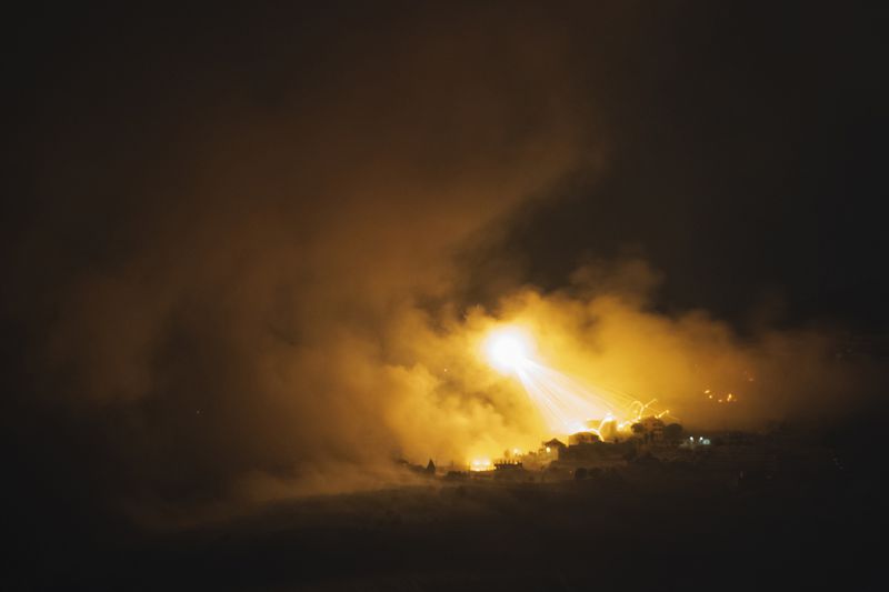 Israeli shelling hits an area in southern Lebanon as seen from northern Israel, early Tuesday, Oct. 1, 2024. (AP Photo/Leo Correa)