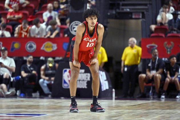 Atlanta Hawks forward Zaccharie Risacher (10) looks on from midcourt during the second half of an NBA summer league basketball game against the Washington Wizards Friday, July 12, 2024, in Las Vegas. (AP Photo/David Becker)