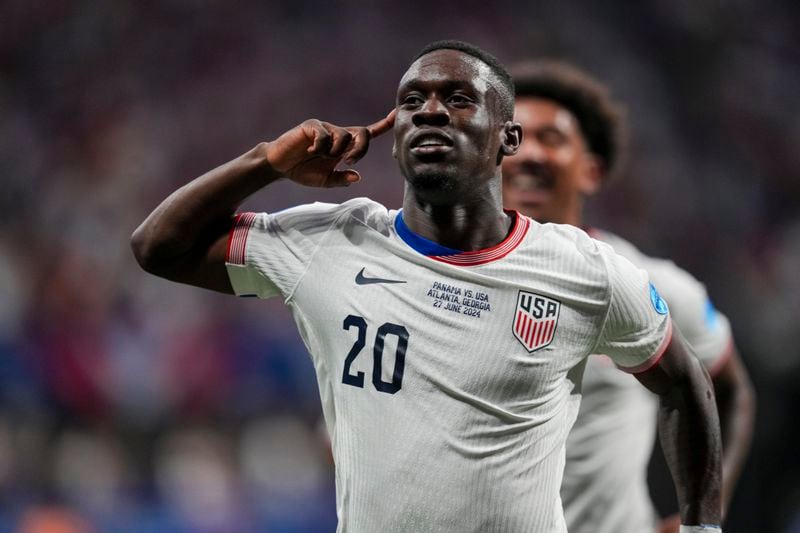 Folarin Balogun of the United States celebrates scoring his side's opening goal against Panama during a Copa America Group C soccer match in Atlanta, Thursday, June 27, 2024. (AP Photo/Jason Allen)