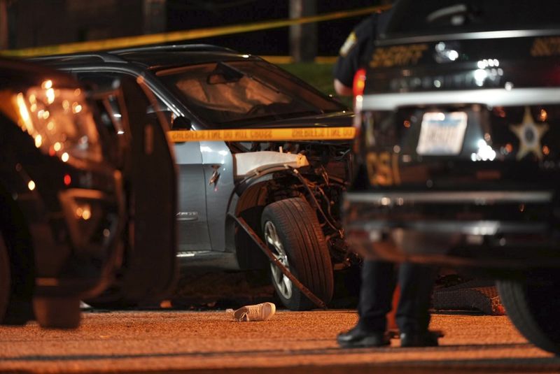 The wreckage of a car is shown at the scene where a car drove into the patio seating area of Park Tavern in St. Louis Park, Minn., Sunday night, Sept. 1, 2024. (Jeff Wheeler/Star Tribune via AP)