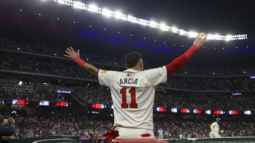 Atlanta Braves shortstop Orlando Arcia (11) reacts as Atlanta Braves designated hitter Marcell Ozuna hits a solo home run during the fifth inning against the New York Mets at Truist Park, Tuesday, Sept. 24, 2024, in Atlanta. The Braves won 5-1. (Jason Getz / AJC)

