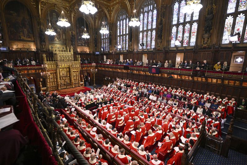 FILE - Members of the House of Lords wait for the start of the State Opening of Parliament at the Houses of Parliament, in London, Tuesday, Nov. 7, 2023. The unelected upper house of Parliament scrutinizes legislation passed by the Commons. It is made up of peers appointed for life by political parties, along with a smattering of judges, bishops and hereditary nobles. (Leon Neal/Pool Photo via AP, File)