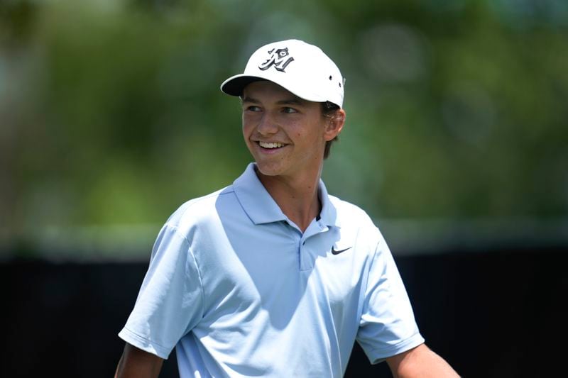 Miles Russell smiles after his tee shot on the 10th hole during the first round of the Rocket Mortgage Classic golf tournament at Detroit Country Club, Thursday, June 27, 2024, in Detroit. (AP Photo/Paul Sancya)