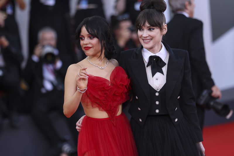 Jenna Ortega, left, and Winona Ryder pose for photographers upon arrival for the premiere of the film 'Beetlejuice Beetlejuice' and the opening ceremony of the 81st edition of the Venice Film Festival in Venice, Italy, on Wednesday, Aug. 28, 2024. (Photo by Vianney Le Caer/Invision/AP)