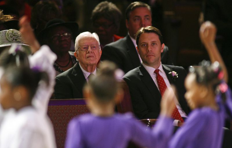 In a 2014 file photo, former President Jimmy Carter and his grandson Jason Carter watch a youth dance performance at Mt. Zion Baptist Church in Albany, Ga. Jason Carter has since been named the chairman of the Carter Center’s board of trustees.  (AP Photo/Phil Sears)