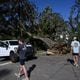 Austin Fosdick (left) and Nealy Hiers, both students at Valdosta State University, check out damages caused by Hurricane Helene near Valdosta State University, Saturday, September 28, 2024, in Valdosta. The devastation in Valdosta was extensive after the South Georgia city was battered with hurricane-force winds on Helene’s path across the state. Damaging Helene has swept through Georgia, leading to at least 15 deaths. All 159 counties are now assessing the devastation and working to rebuild, even as serious flooding risks linger. (Hyosub Shin / AJC)