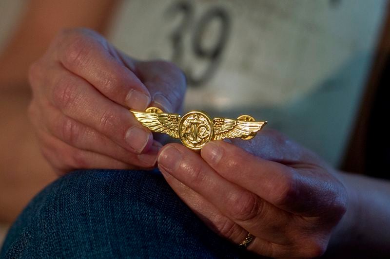 Alexia Collart holds a pin belonging to her son, Marine Corporal Spencer R. Collart, at her home, in Arlington, Va., Thursday, June 19, 2024. Her son was killed along with two other Marines when the MV-22B Osprey aircraft they were on crashed during drills on a north Australian island on August 27, 2023. (AP Photo/Rod Lamkey, Jr.)