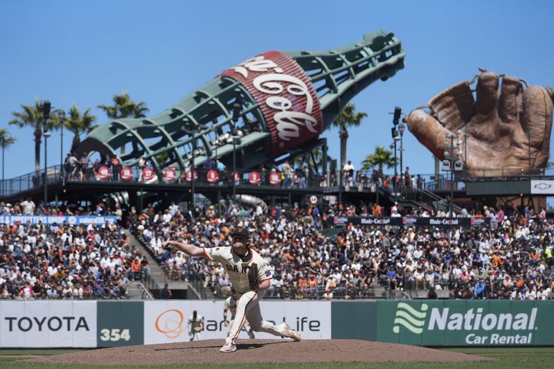 San Francisco Giants' Logan Webb pitches to an Atlanta Braves batter during the eighth inning of a baseball game Thursday, Aug. 15, 2024, in San Francisco. (AP Photo/Godofredo A. Vásquez)