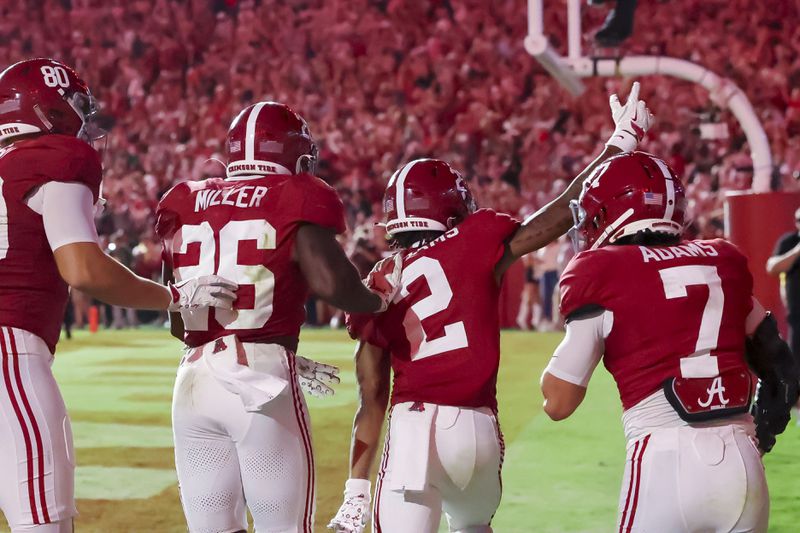 Alabama wide receiver Ryan Williams (2) celebrates a 75-yard touchdown against Georgia during the second half of an NCAA college football game against Georgia, Saturday, Sept. 28, 2024, in Tuscaloosa, Ala. Williams is joined by Alabama running back Jam Miller (26) and wide receiver Cole Adams (7). (AP Photo/Vasha Hunt)