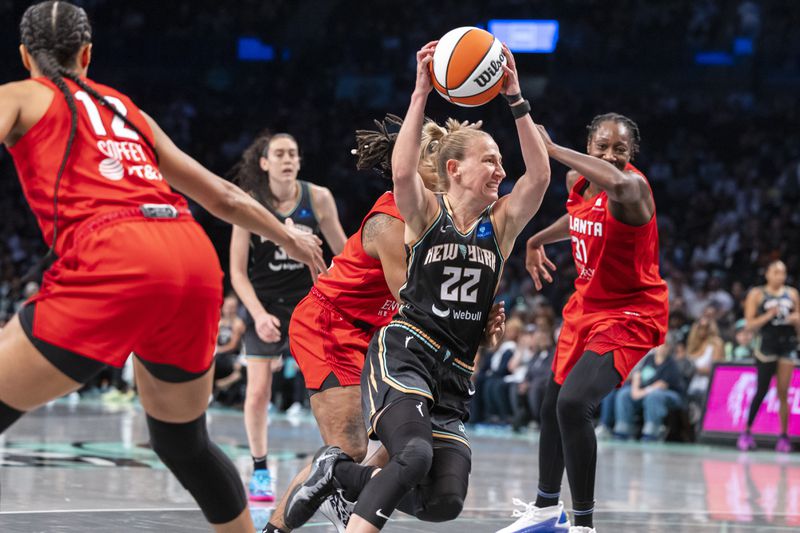 New York Liberty guard Courtney Vandersloot (22) drives to the basket during the first half of a WNBA basketball first-round playoff game against the Atlanta Dream, Sunday, Sept. 22, 2024, in New York. (AP Photo/Corey Sipkin)