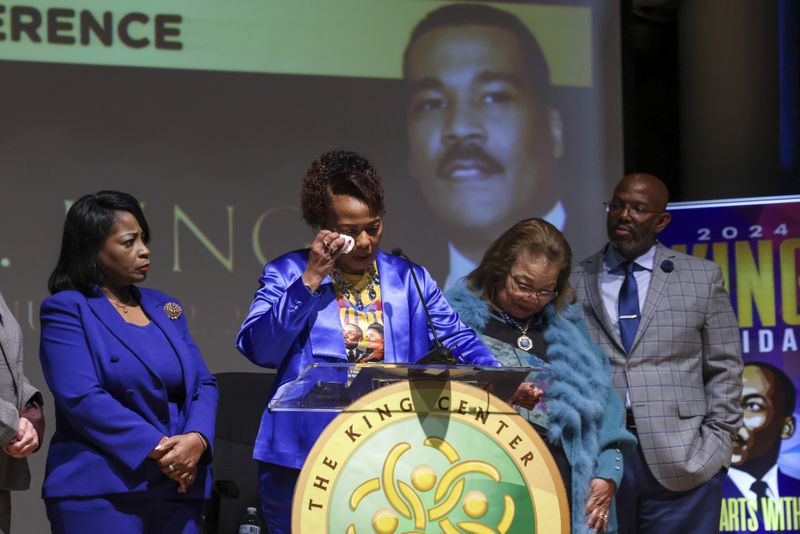 Bernice King, center, gets emotional as she speaks during a press conference on the passing of her brother, Dexter Scott King, son of Dr. Martin Luther King, Jr. at the Yolanda D. King Theatre for the Performing Arts, Tuesday, January 23, 2024. Also pictured is Angela Farris Watkins, left, Alveda King, second from right, and King Estate General Council Eric Tidwell, right. (Jason Getz/jason.getz@ajc.com)