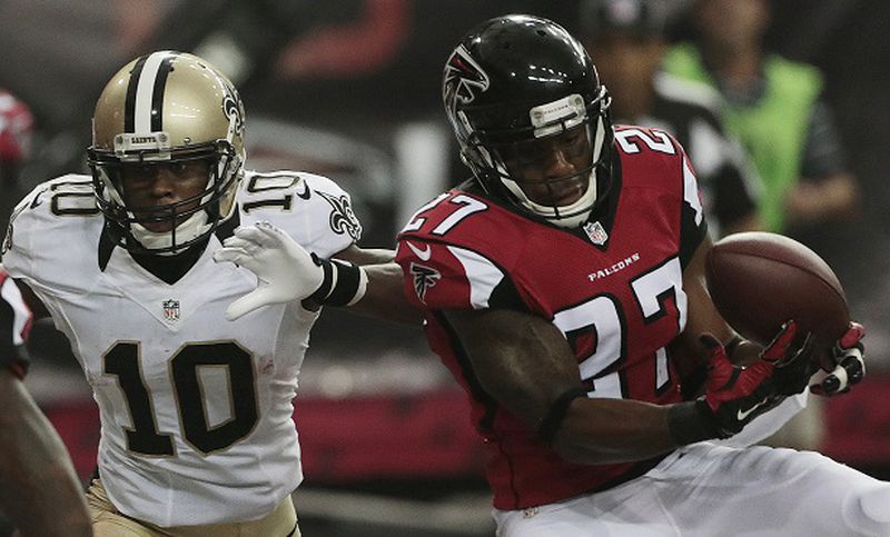 Atlanta Falcons cornerback Robert McClain (27) makes a catch for an interception as the intended receiver New Orleans Saints wide receiver Brandin Cooks (10) looks on during the second half of an NFL football game, Sunday, Sept. 7, 2014, in Atlanta. (AP Photo/John Bazemore) Robert McClain makes a point-saving interception. (John Bazemore/AP)