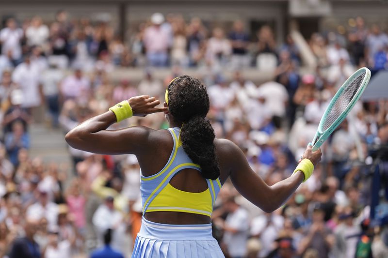 Coco Gauff, of the United States, motions to the crowd after defeating Elina Svitolina, of Ukraine, during the third round of the U.S. Open tennis championships, Friday, Aug. 30, 2024, in New York. (AP Photo/Seth Wenig)