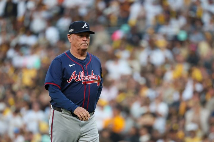 Atlanta Braves manager Brian Snitker makes a pitching change against the San Diego Padres during the second inning of National League Division Series Wild Card Game One at Petco Park in San Diego on Tuesday, Oct. 1, 2024.   (Jason Getz / Jason.Getz@ajc.com)