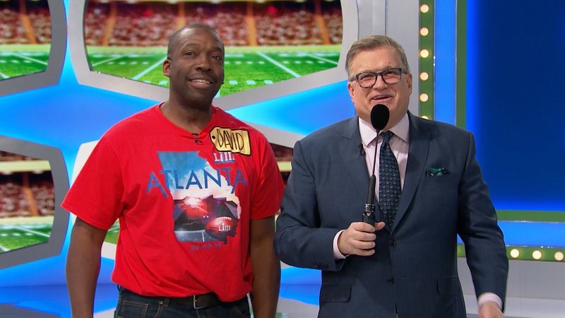 DeKalb County firefighter David Smalls pictured with The Price is Right host Drew Carey.