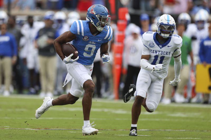 Mississippi wide receiver Tre Harris (9) runs the ball during the first half of an NCAA college football game against Kentucky Saturday, Sept. 28, 2024, in Oxford, Miss. (AP Photo/Randy J. Williams)