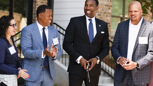 From left to right: Invest Atlanta President and CEO Eloisa Klementich, Atlanta Beltline President and CEO Clyde Higgs, Atlanta Mayor Andre Dickens, and Edrick Harris of Prestwick Development at the ribbon cutting for the opening of Parkside, a new affordable housing community on the Beltline Westside trail on Wednesday June 1, 2022. (Natrice Miller / natrice.miller@ajc.com)