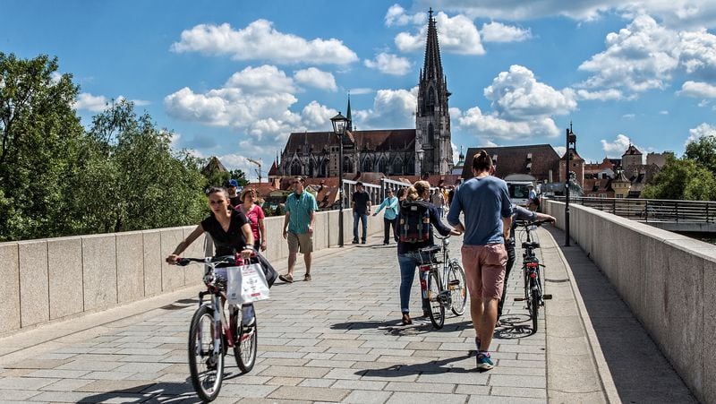 The stone bridge over the Danube, built in 1146, connects Regensburg's "new" town with the historic "old" town on the far side. At rear, the Strudel Tower, so-named for "the whirlpool eddies, or strudels, in the river below," said City guide Ulrike Unger. The oldest of Regensburg's 20 towers, they count less than half of the 50 towers that once graced this medieval town. (Steve Haggerty/Colorworld/TNS)