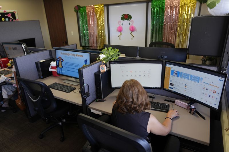 Senior Customer Experience Representative Laura Faubion takes calls at an Alorica center, Monday, Aug. 19, 2024, in San Antonio. (AP Photo/Eric Gay)