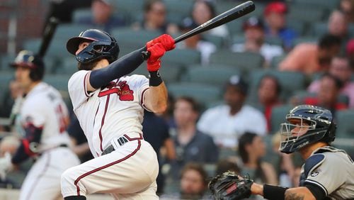 Braves shortstop Dansby Swanson follows through on his solo home run which tied the game at 1 in the bottom of the second inning Monday, Aug. 24, 2021, against the New York Yankees at Truist Park in Atlanta. (Curtis Compton/Curtis.Compton@ajc.com)