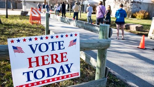 FILE - Patrons of the Gallatin County Fairgrounds wait in line to cast their ballots in Bozeman, Mont., Nov. 3, 2020. (AP Photo/Tommy Martino, File)