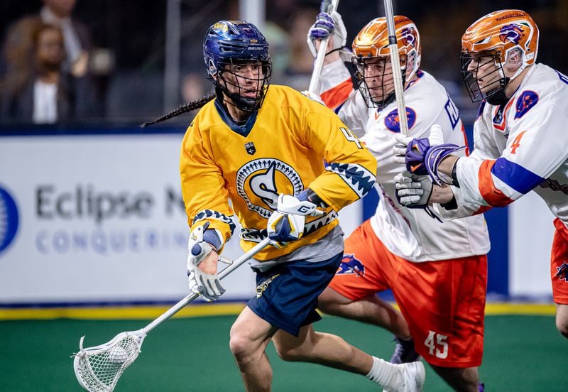 The Georgia Swarm’s roster features top Native American lacrosse athletes, including one of the greatest in the world, Lyle Thompson, left, of the Onondaga Nation. While competing for the University at Albany in New York, Thompson was twice awarded the Tewaaraton Award, lacrosse’s equivalent of football’s Heisman Trophy. Courtesy of Kyle Hess/Georgia Swarm