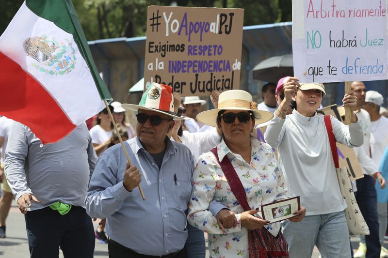 Federal court workers gather as they strike over reforms that would make all judges stand for election in Mexico City, Sunday, Aug. 25, 2024. (AP Photo/Ginnette Riquelme)