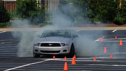 A student spins out during Ford Motor Company Driving Skills for Life Program.
