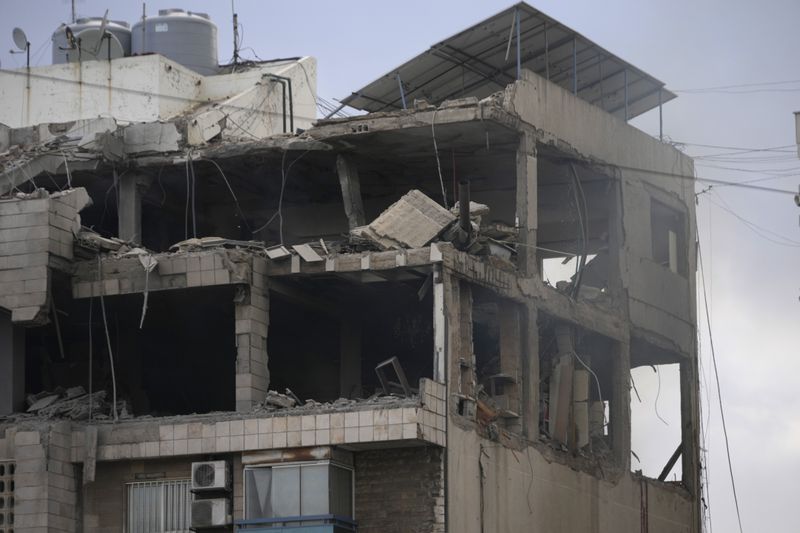 A damaged building hit in an Israeli airstrike in Bir Hassan, Beirut, Lebanon, Tuesday, Oct. 1, 2024. (AP Photo/Hussein Malla)