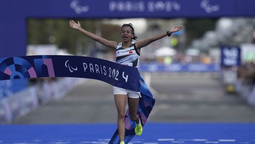 Morocco's Fatima Ezzahra El Idrissi wins the women's marathon T12 at the 2024 Paralympics, Sunday, Sept. 8, 2024, in Paris, France. (AP Photo/Thibault Camus)