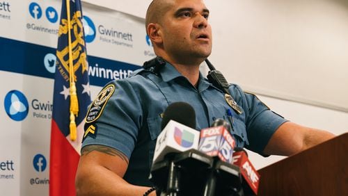 Gwinnett County police Cpl. Juan Madiedo provides updates Thursday afternoon after six suspects were arrested and charged with murder after a woman's body was found in a trunk.