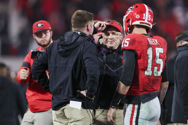 Georgia coach Kirby Smart talks with Georgia quarterback Carson Beck (15) during their game against Mississippi at Sanford Stadium, Saturday, November 11, 2023, in Athens, Ga. Georgia won 52-17. (Jason Getz / Jason.Getz@ajc.com)