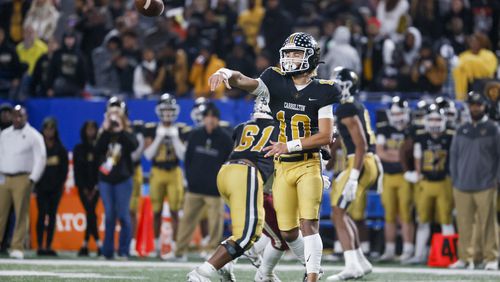 Carrollton quarterback Julian Lewis (10) attempts a pass during the second half against Mill Creek in the GHSA Class 7A finals, at Center Parc Stadium, Saturday, December 10, 2022, in Atlanta. Mill Creek defeated Carrollton 70-35. Carrollton freshman quarterback Julian Lewis threw for a state championship game record 531 yards and five touchdowns. (Jason Getz / Jason.Getz@ajc.com)