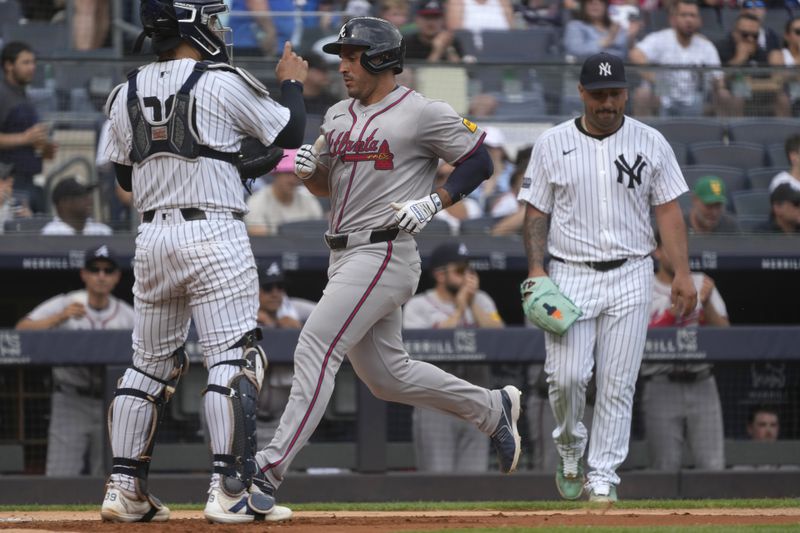 Atlanta Braves' Orlando Arcia scores on a single hit by Ozzie Albies during the fifth inning of a baseball game against the New York Yankees, Sunday, June 23, 2024, in New York. (AP Photo/Pamela Smith)