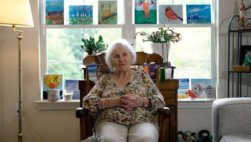 Lillian Mortimer never expected to live anything close to what she has. The 107-year-old, who lives in an assisted living facility in Cobb County, thrives staying busy, including taking painting classes for the first time in her life. (Robyn Hutson/AJC)