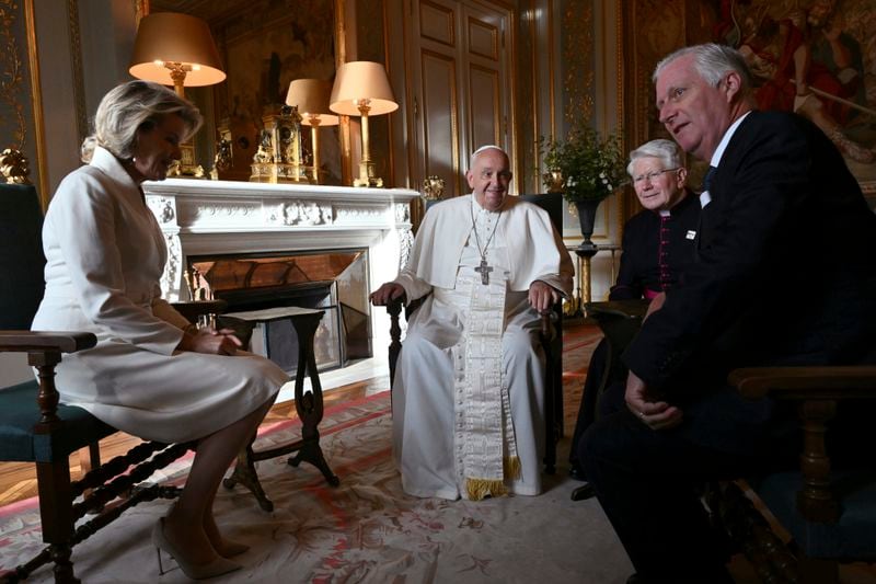 Pope Francis, center, talks to King Philippe of Belgium, right, and Queen Mathilde at the Castle of Laeken, Belgium, Friday, Sept. 26, 2024, on the second day of a four-day apostolic journey to Luxembourg and Belgium. (Alberto Pizzoli/pool photo via AP)